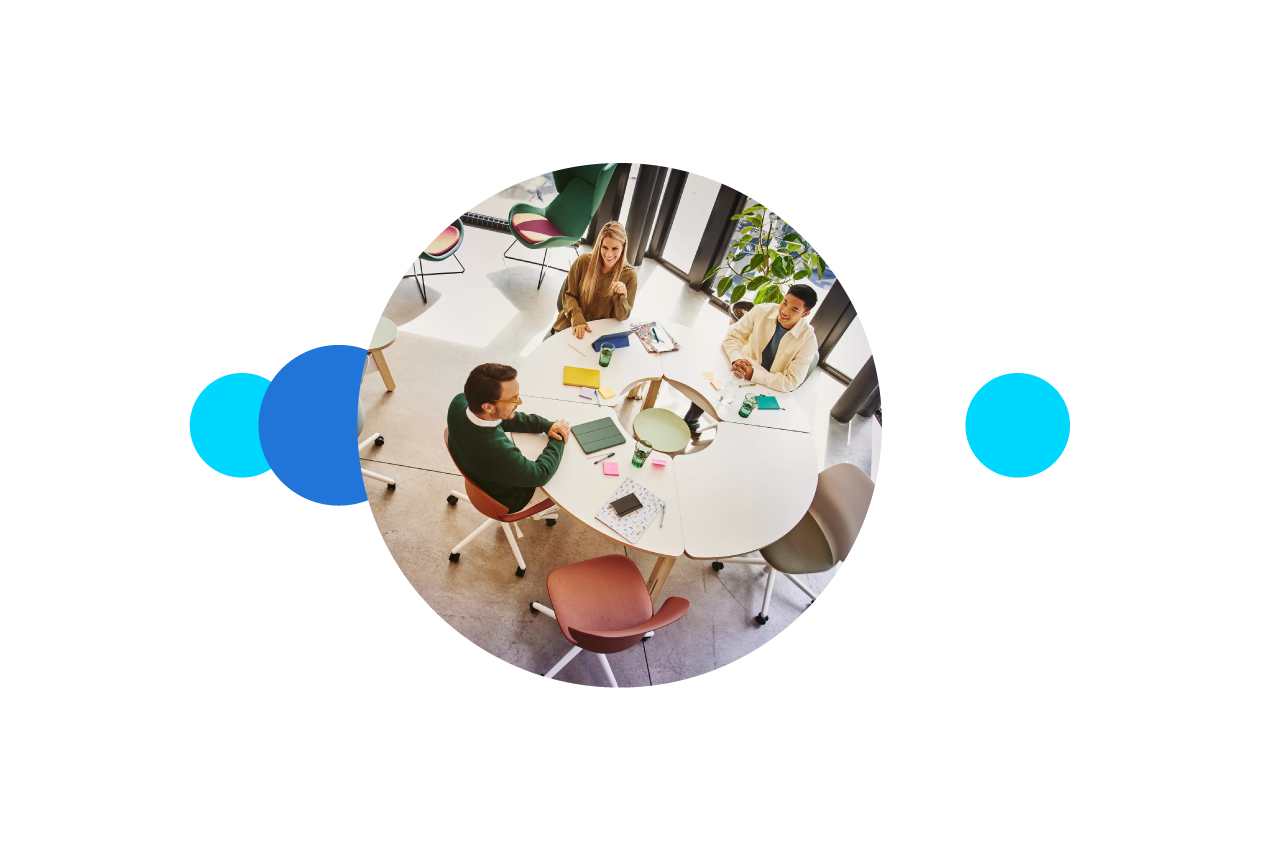Bird view of people sitting at a round table and having a meeting