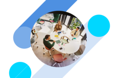 Bird view of people sitting at a round table and having a meeting