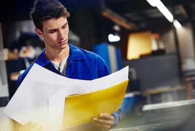 A man looking at reports