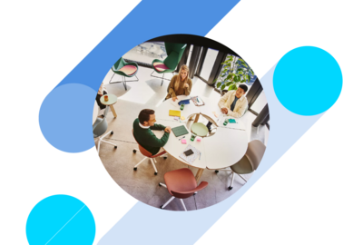 Bird view of people sitting at a round table and having a meeting
