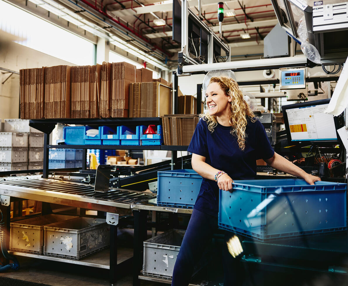 A woman with a crate